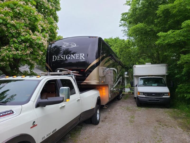 A camper being towed by a truck 