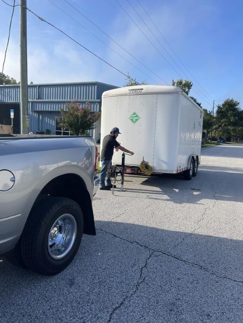 A man fastening a trailer 