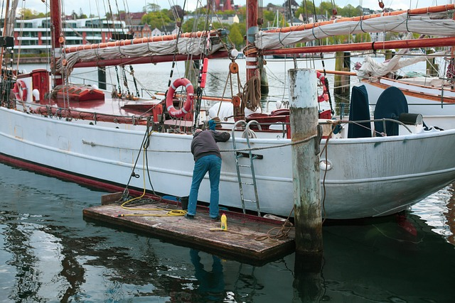 A boat being worked on in a jetty 