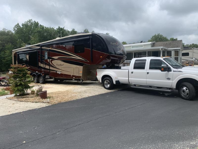 A camper being towed by a truck 