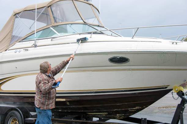 A man washing his boat 