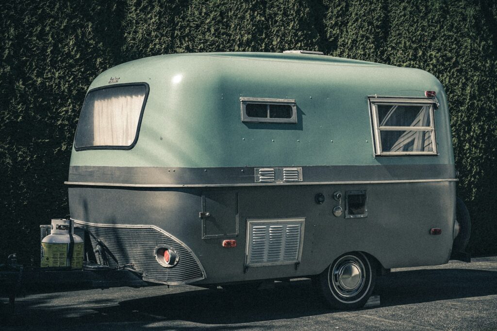 a silver trailer with a window
