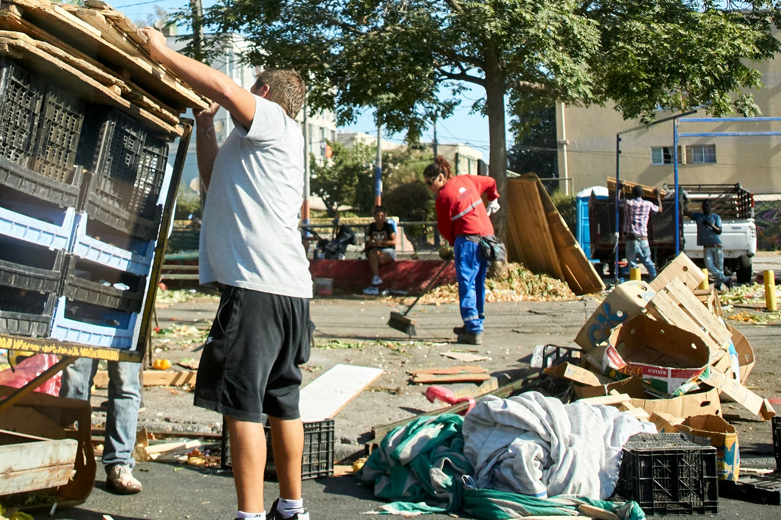 a man standing next to a pile of junk Utilizing A (Shower Trailer) During Emergencies | Understanding How It Works