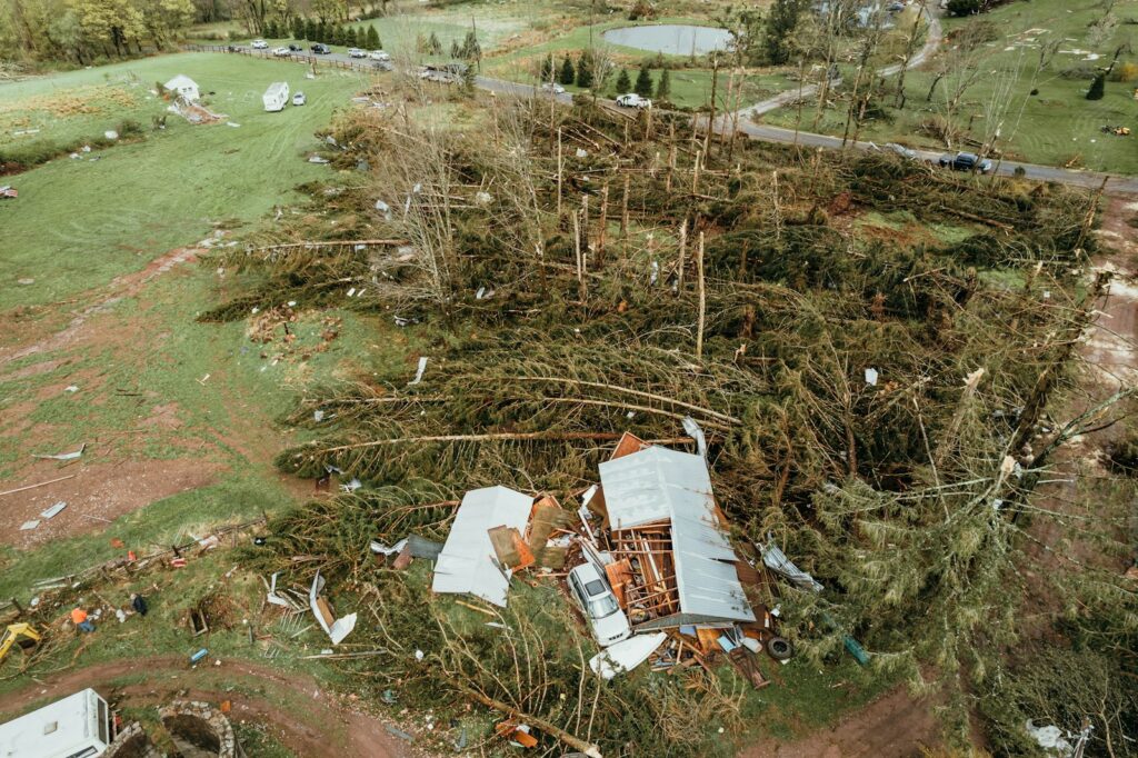 a house that has been torn down in the middle of a field