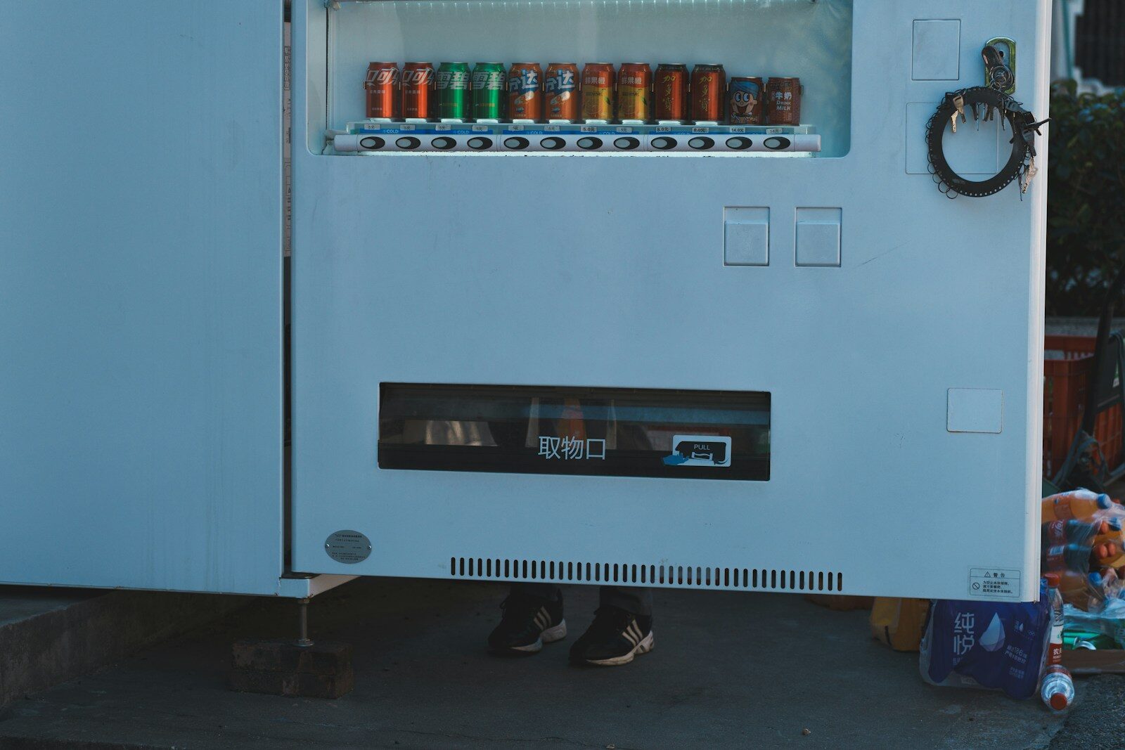Photo by Toxic Smoker A vending machine sitting on the side of a road