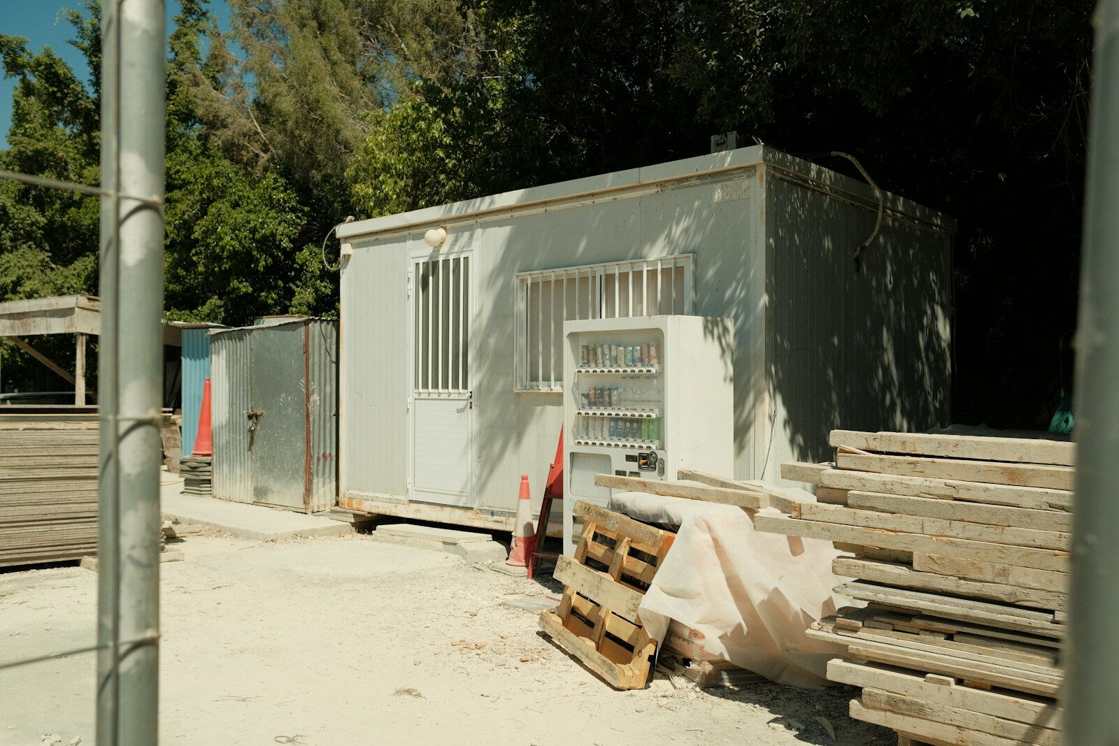 Portable buildings and construction materials on site.