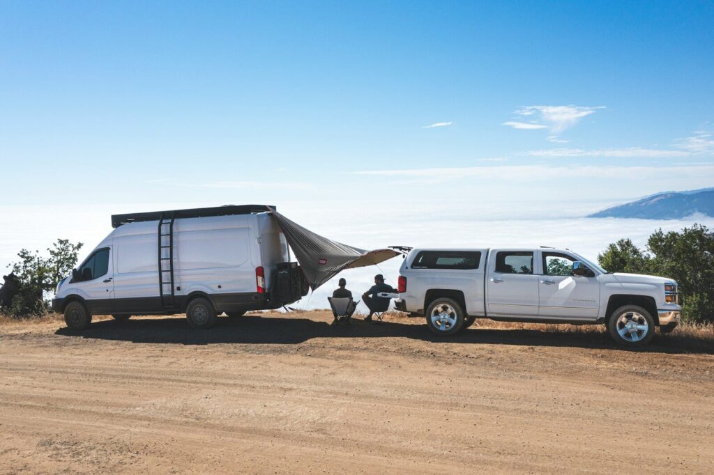 white van on brown sand during daytime