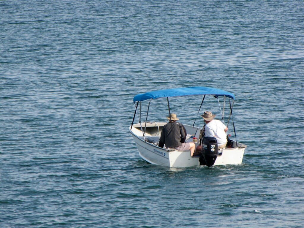 Two people in a boat on the water