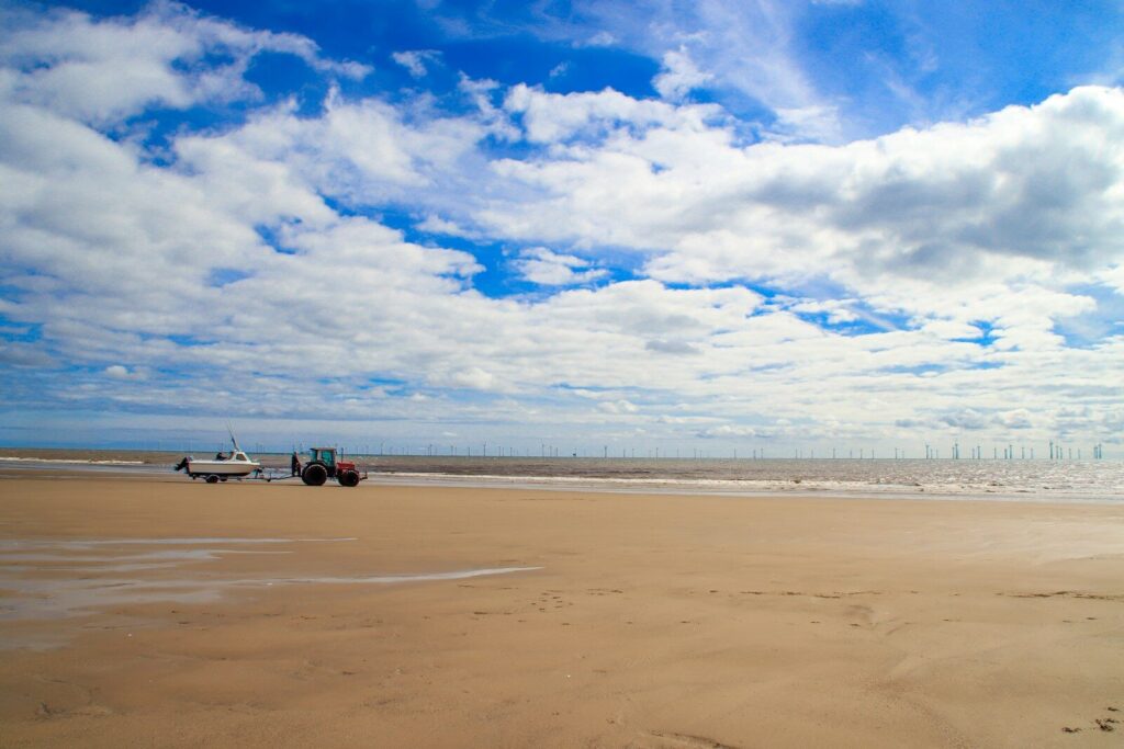 a tractor on a beach