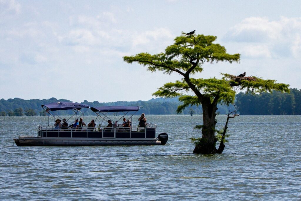 a boat with people on it in the water