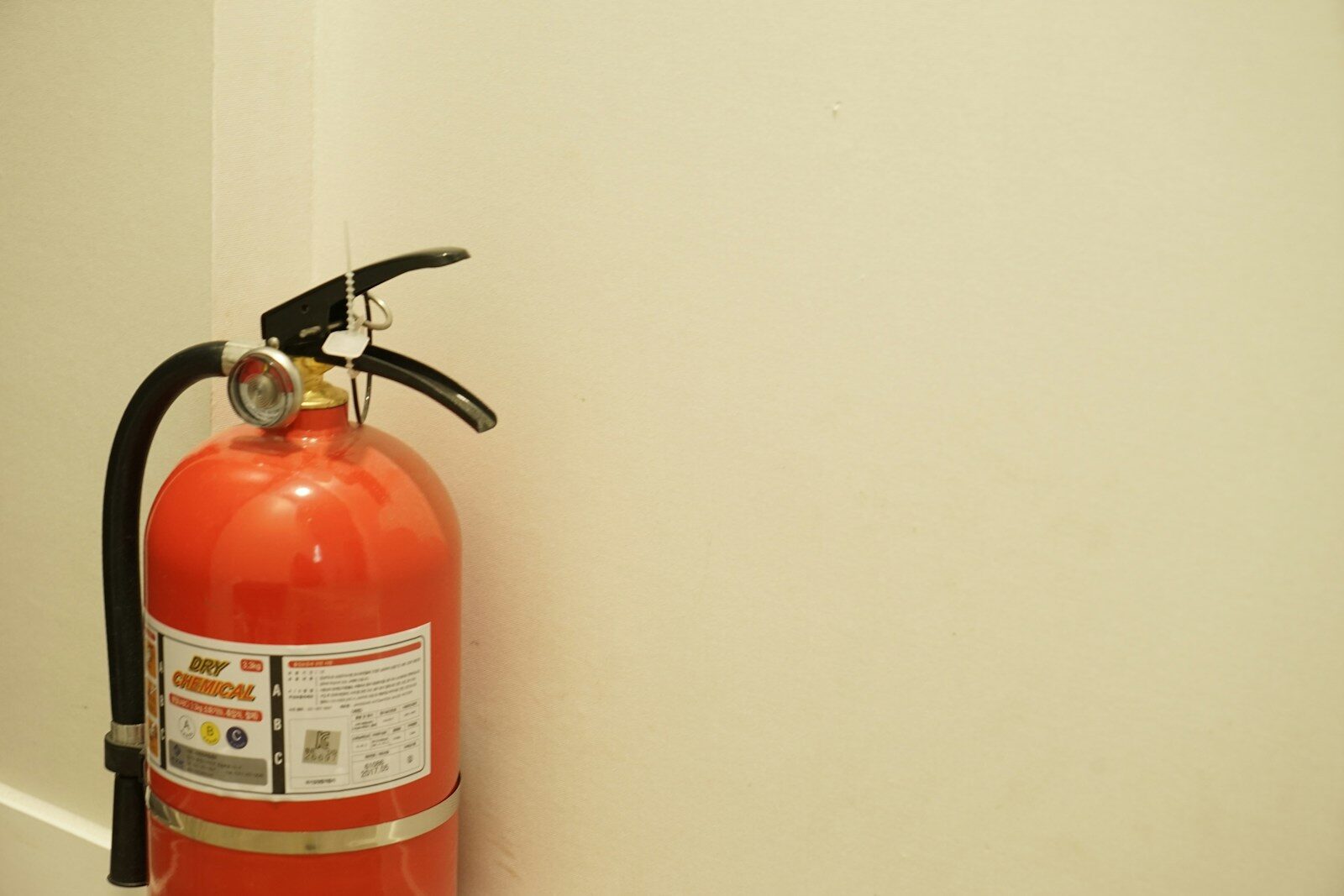 a fire extinguisher on a wall