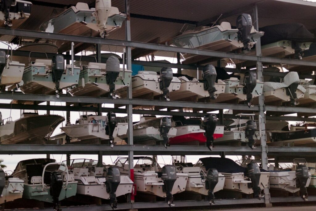 Boats stored on multi-level racks indoors
