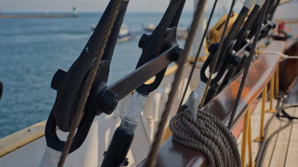 black and white rope on brown metal rod