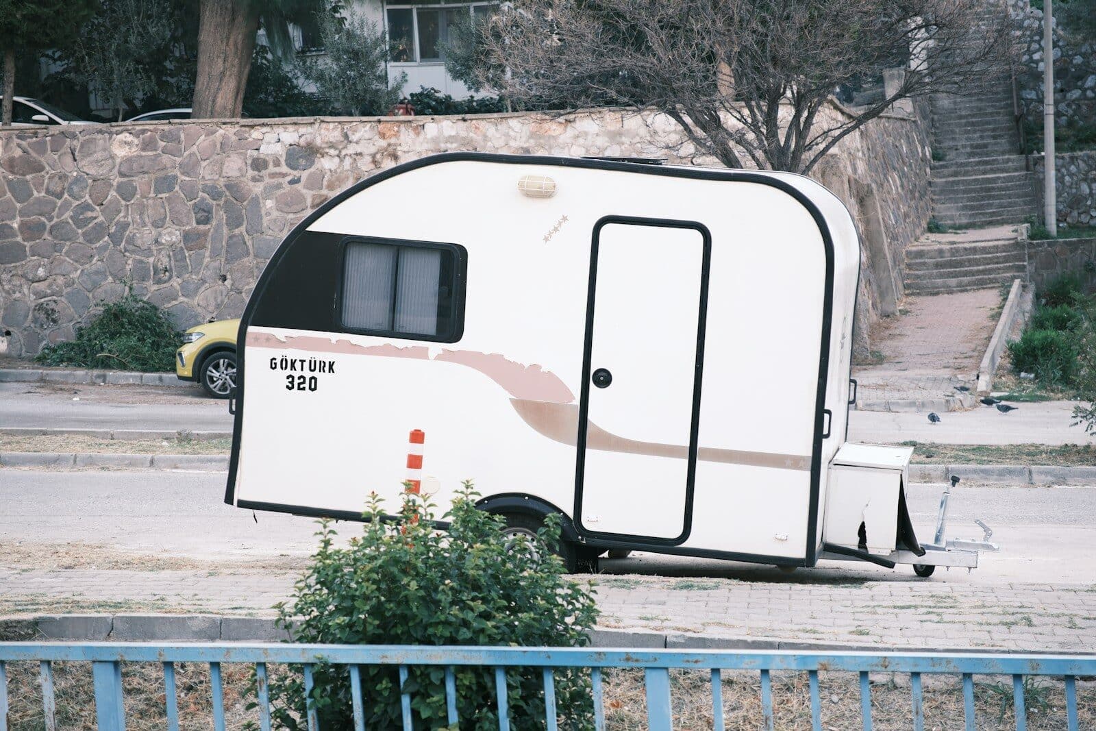 A white trailer parked on the side of a road 15 Uses for a Small Enclosed Trailer You May Not Have Considered