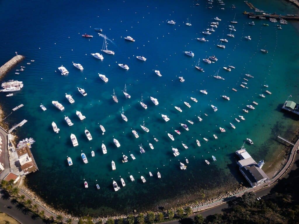 boats in body of water near island
