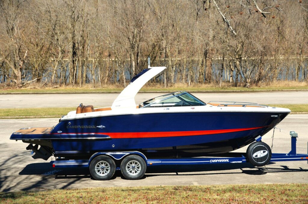 a blue and red boat on a trailer