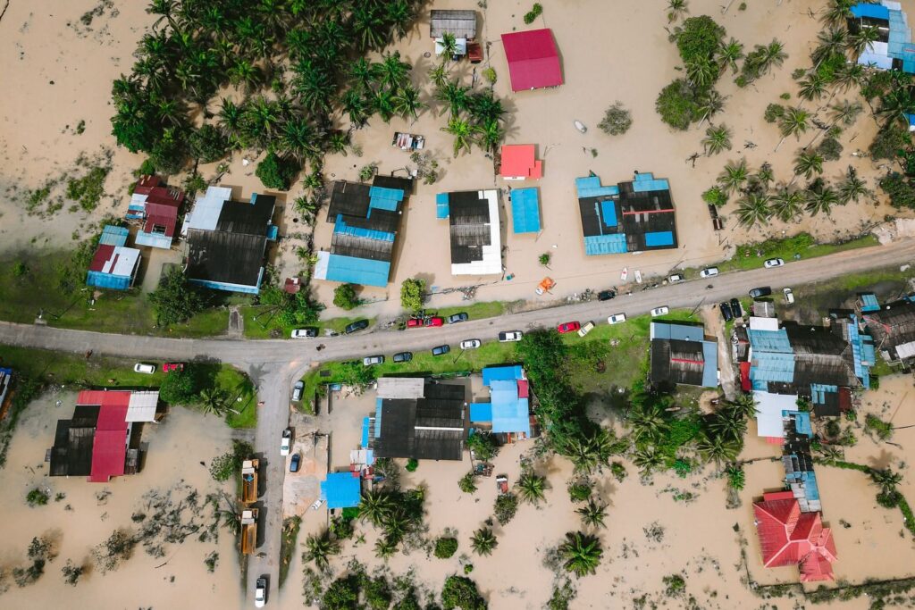 Aerial shot showing flooded houses in Kijal, Terengganu, Malaysia, highlighting the impact of natural disasters.