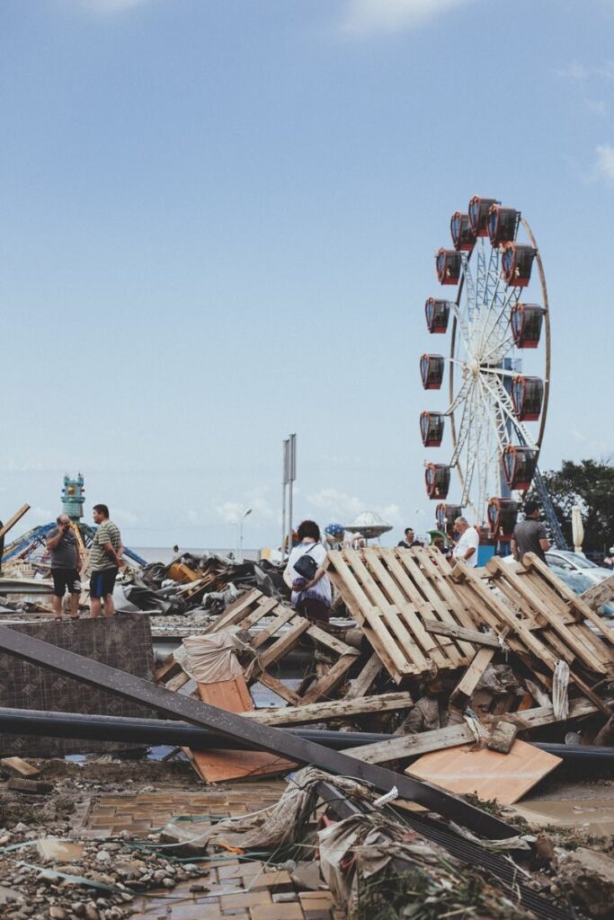 Devastation after a natural disaster with debris and a ferris wheel in Lermontovo, Russia.
